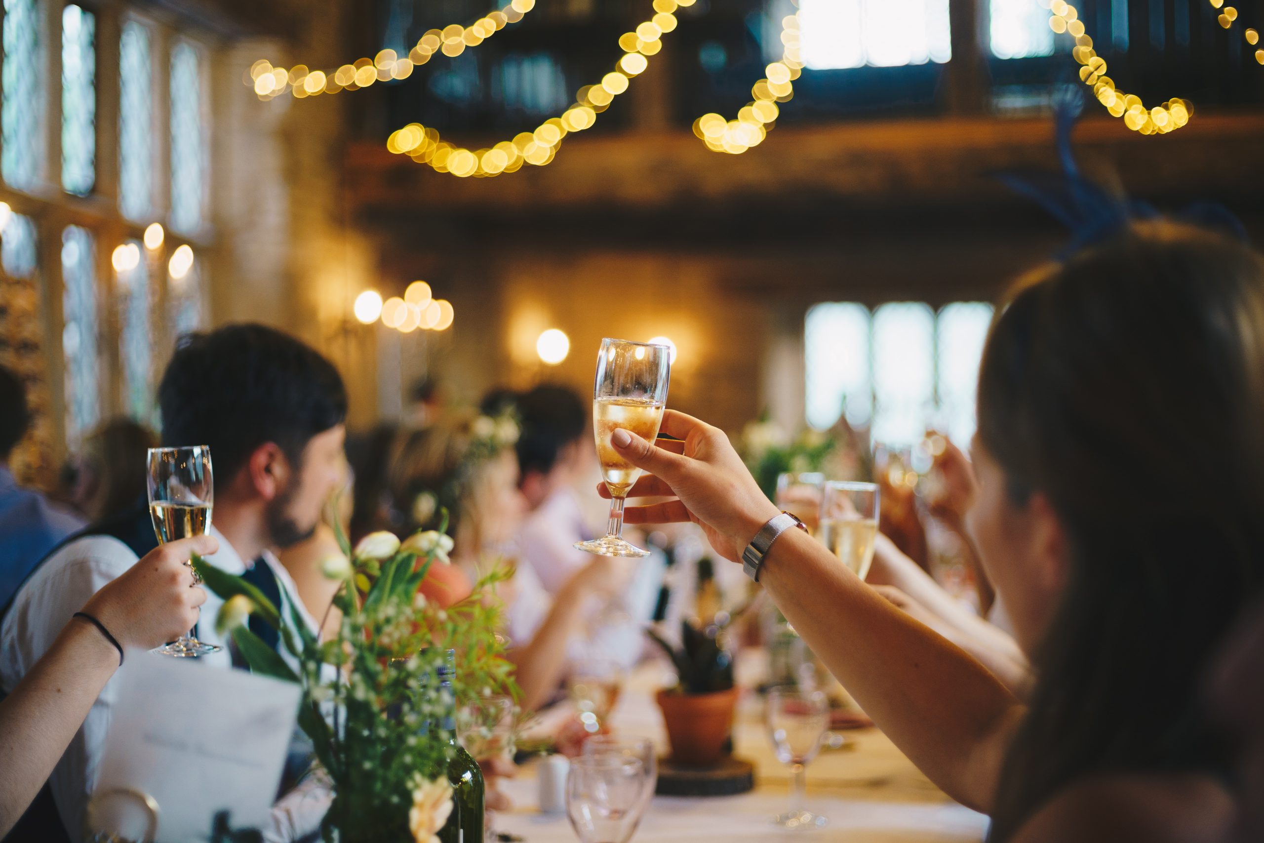 people-raising-glasses-at-event